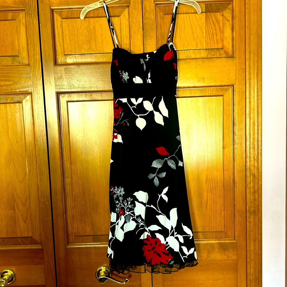 Black with red and white pattern spaghetti strap medium size above the knee